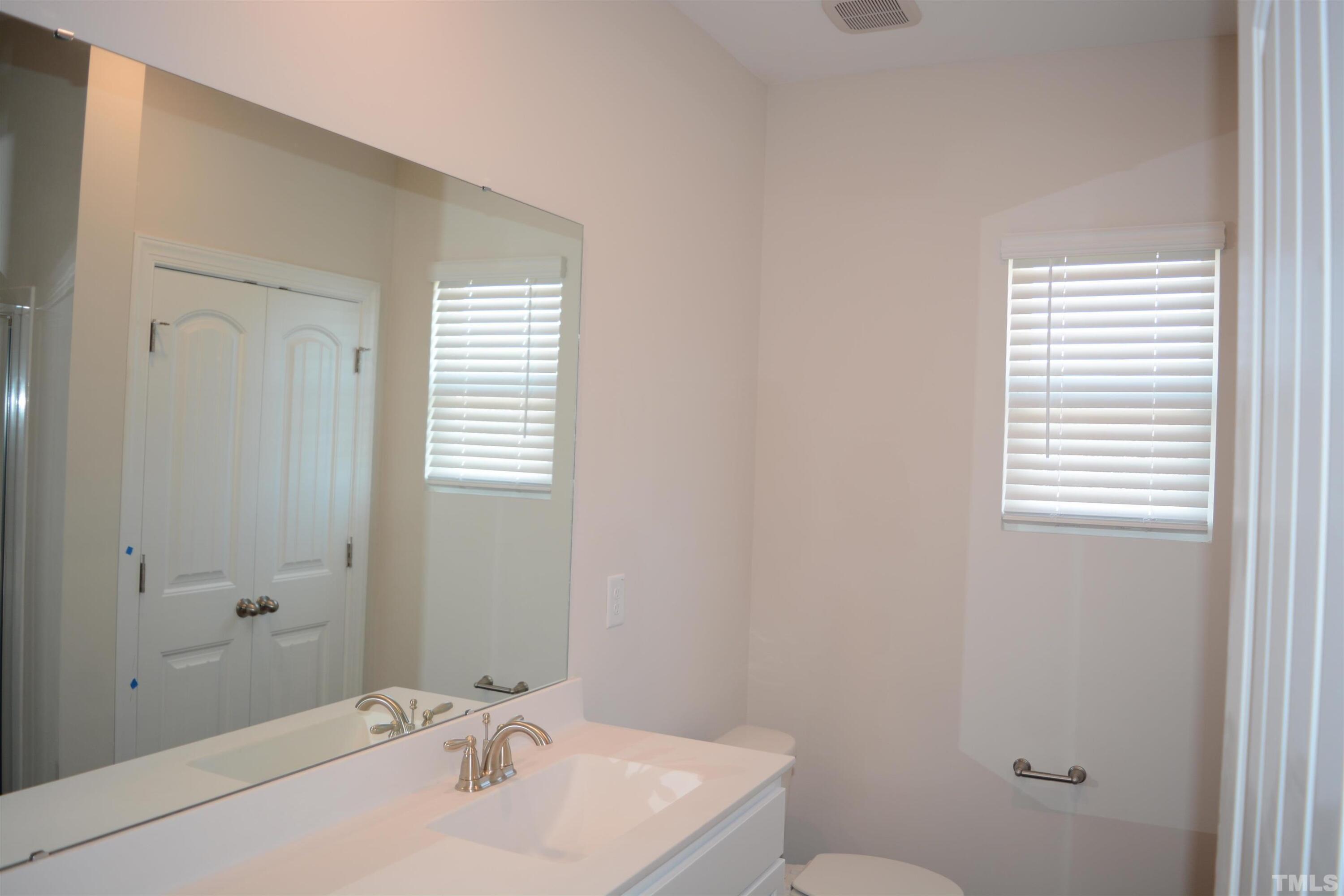 45 Level Drive Youngsville, NC 27596 - Photo 4 of 7 a bathroom with a sink and a toilet