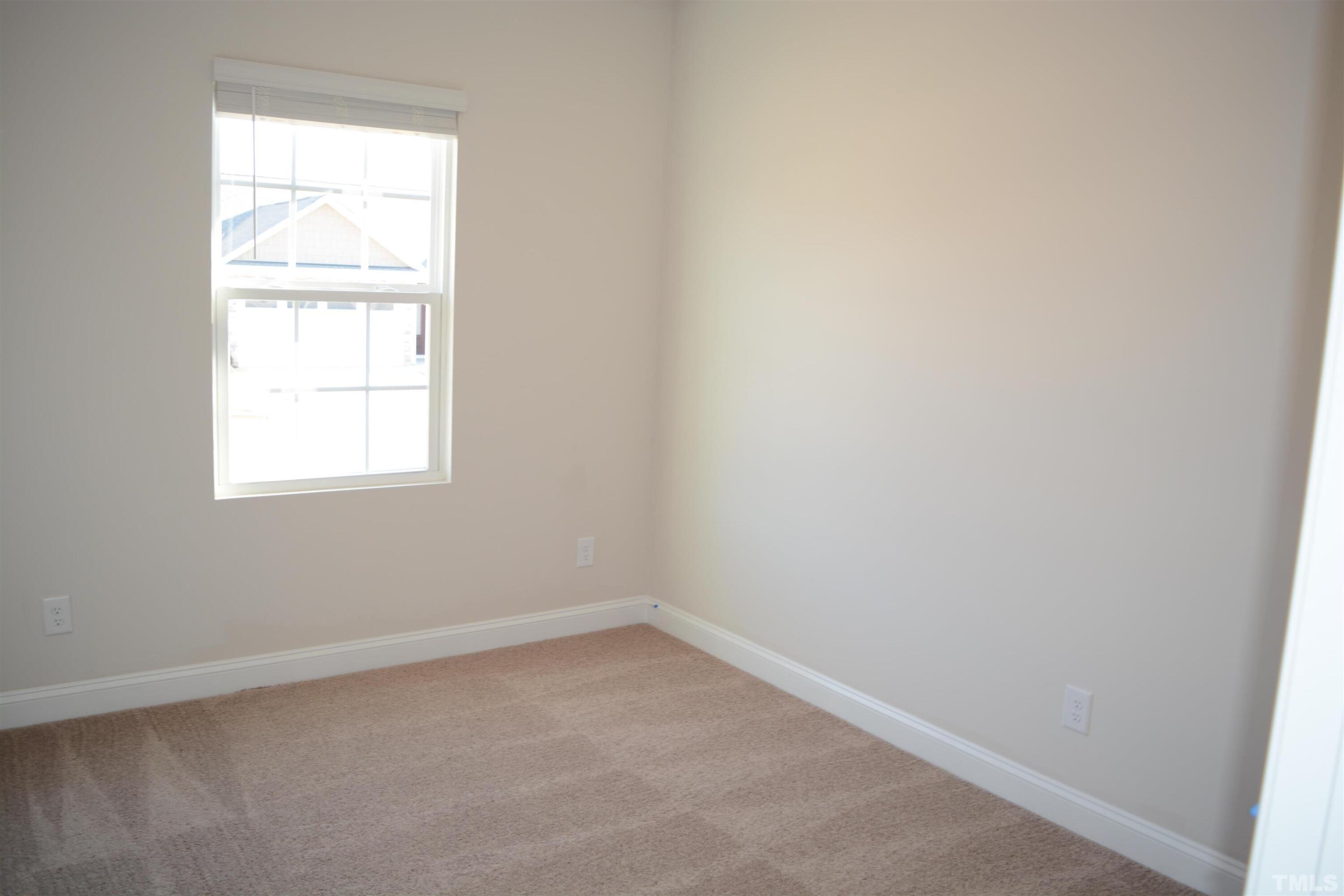 45 Level Drive Youngsville, NC 27596 - Photo 7 of 7 an empty room with a window