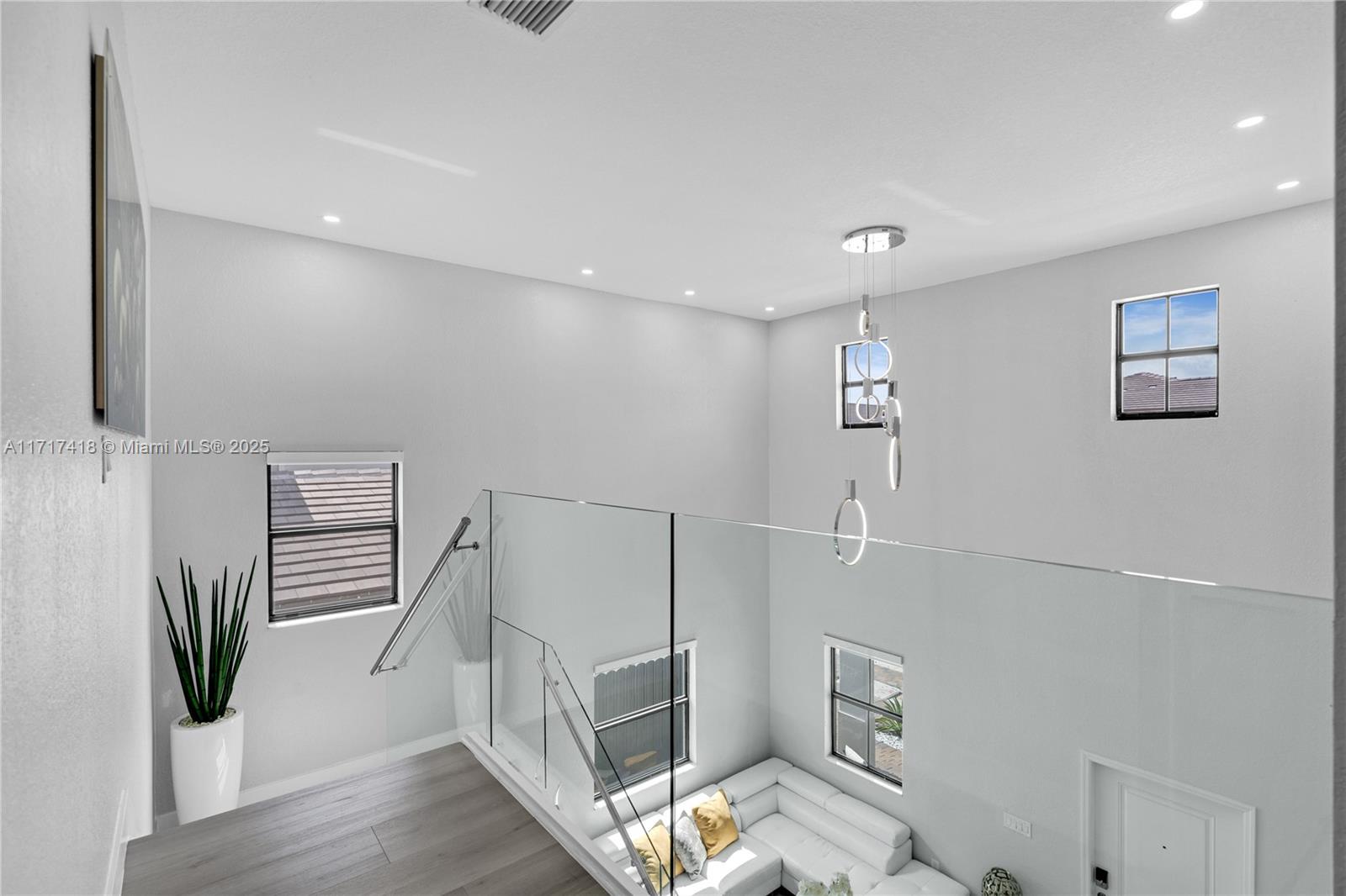 12953 Southwest 230th Street Miami, FL 33170 - Photo 20 of 49 a view of entryway and livingroom with wooden floor