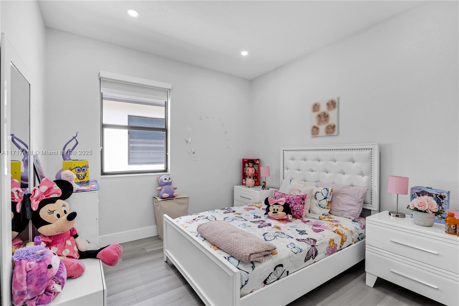 12953 Southwest 230th Street Miami, FL 33170 - Photo 26 of 49 a bedroom with a bed and a window