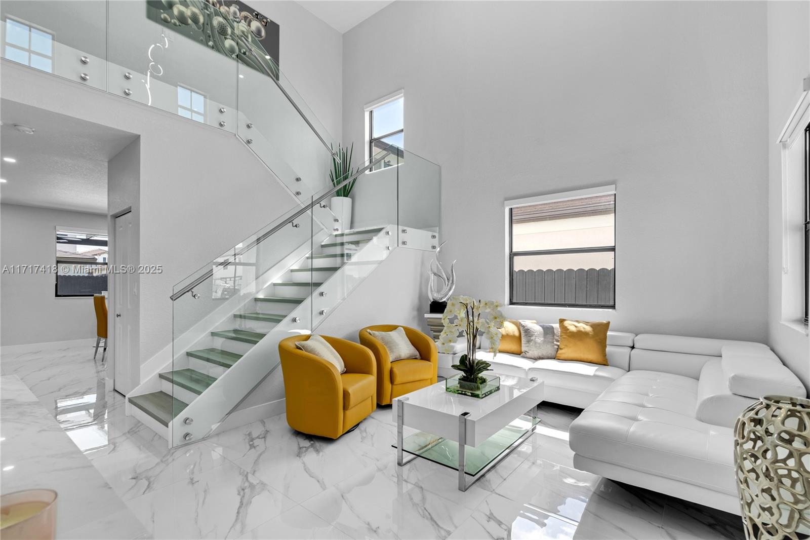 12953 Southwest 230th Street Miami, FL 33170 - Photo 3 of 49 a living room with furniture and stairs