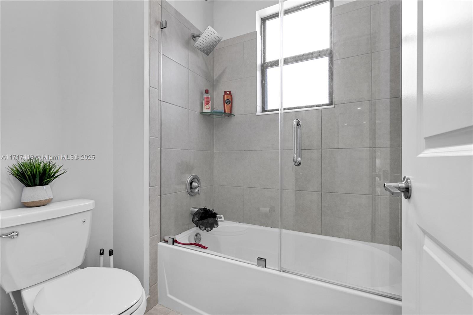 12953 Southwest 230th Street Miami, FL 33170 - Photo 34 of 49 a white toilet sitting next to a bath tub