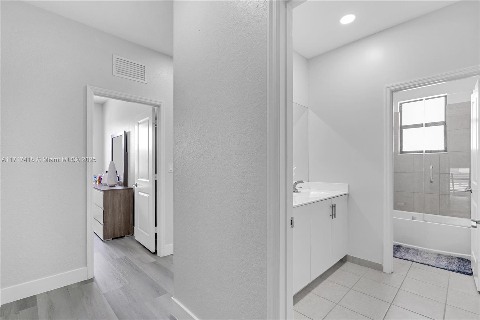 12953 Southwest 230th Street Miami, FL 33170 - Photo 37 of 49 a view of an empty room with closet and a window