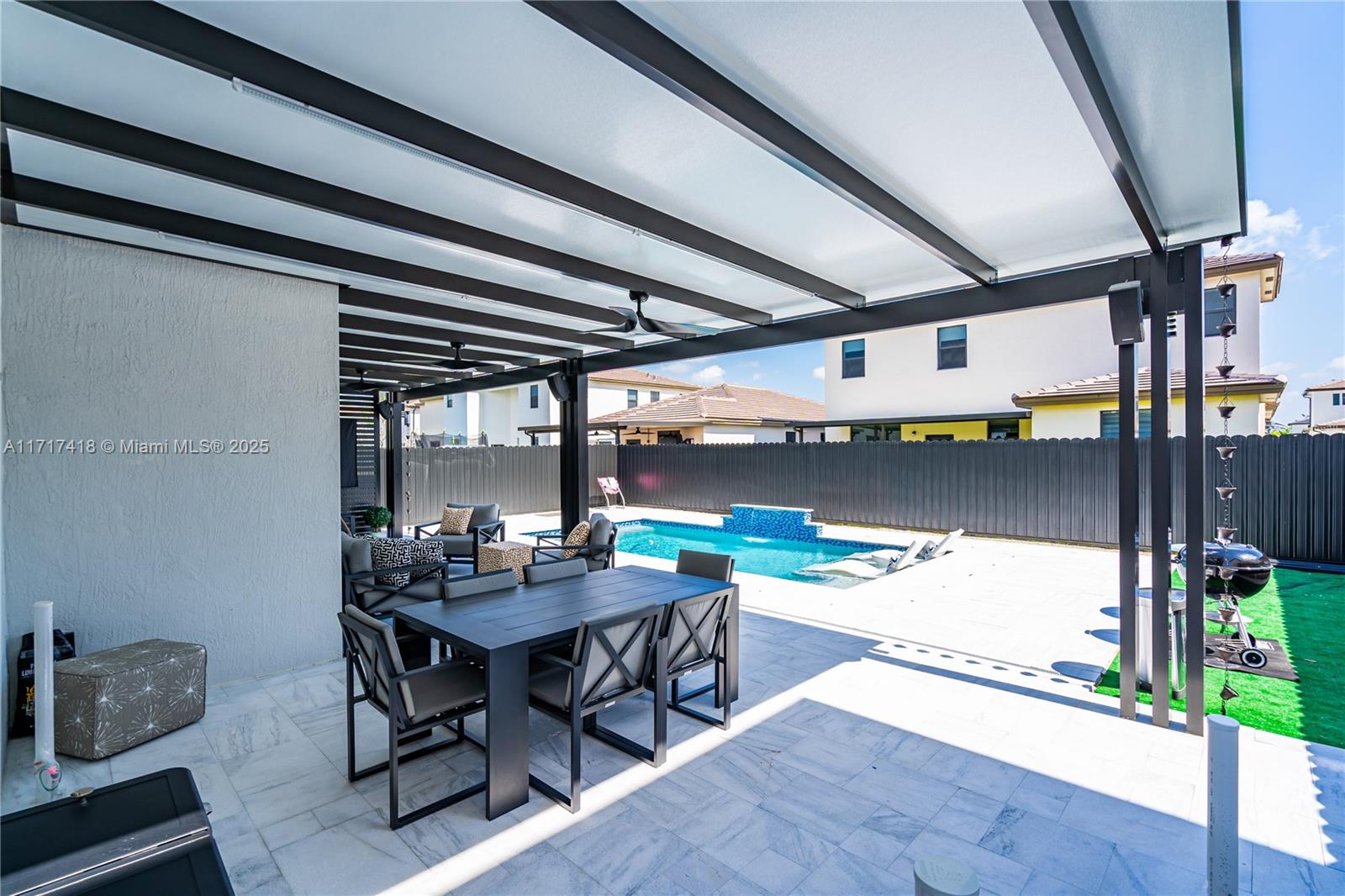 12953 Southwest 230th Street Miami, FL 33170 - Photo 38 of 49 a dining room with furniture and a floor to ceiling window