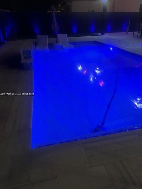 12953 Southwest 230th Street Miami, FL 33170 - Photo 46 of 49 a view of a street with red lights