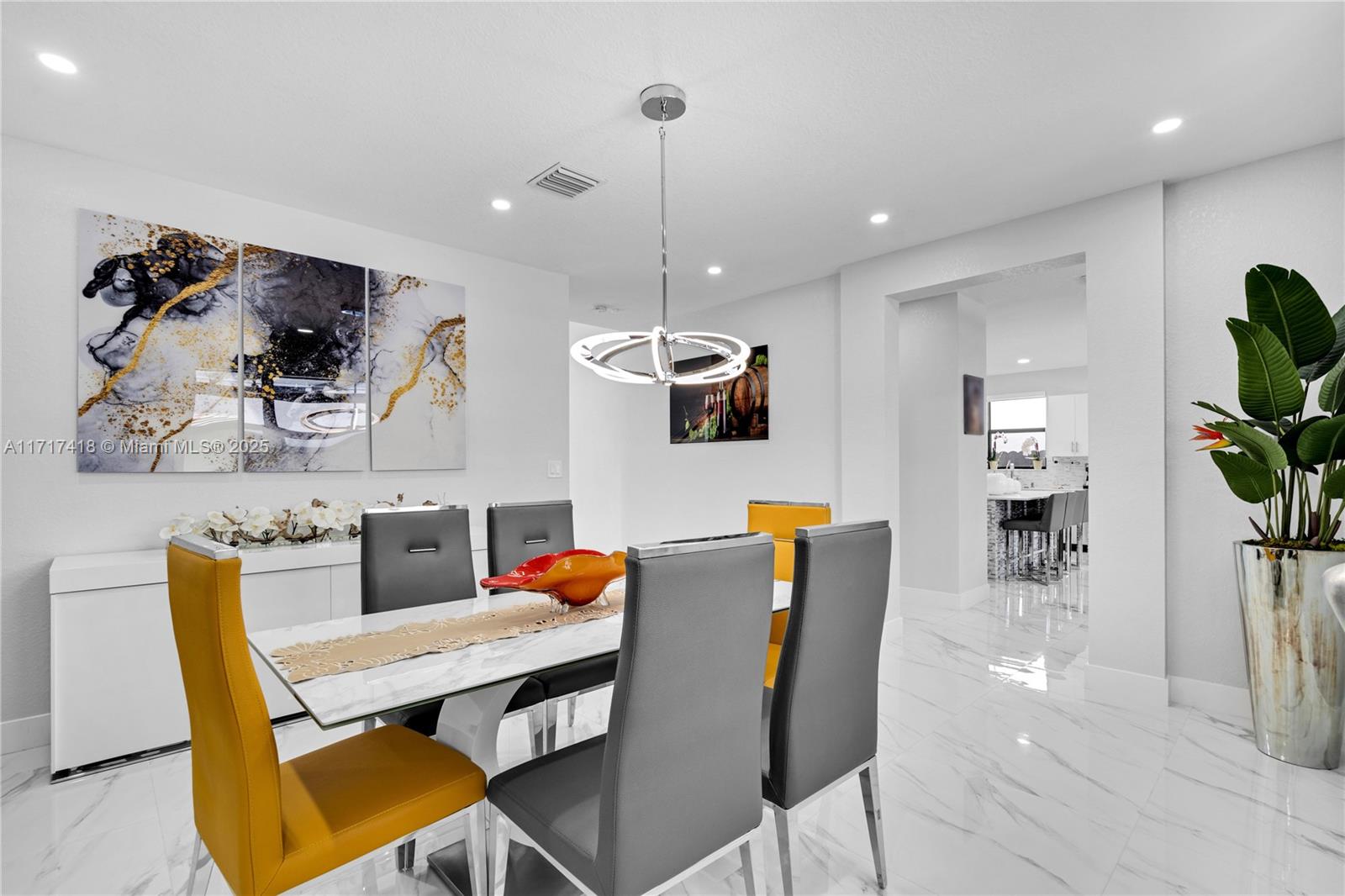 12953 Southwest 230th Street Miami, FL 33170 - Photo 7 of 49 a dining room dining table chairs and a chandelier