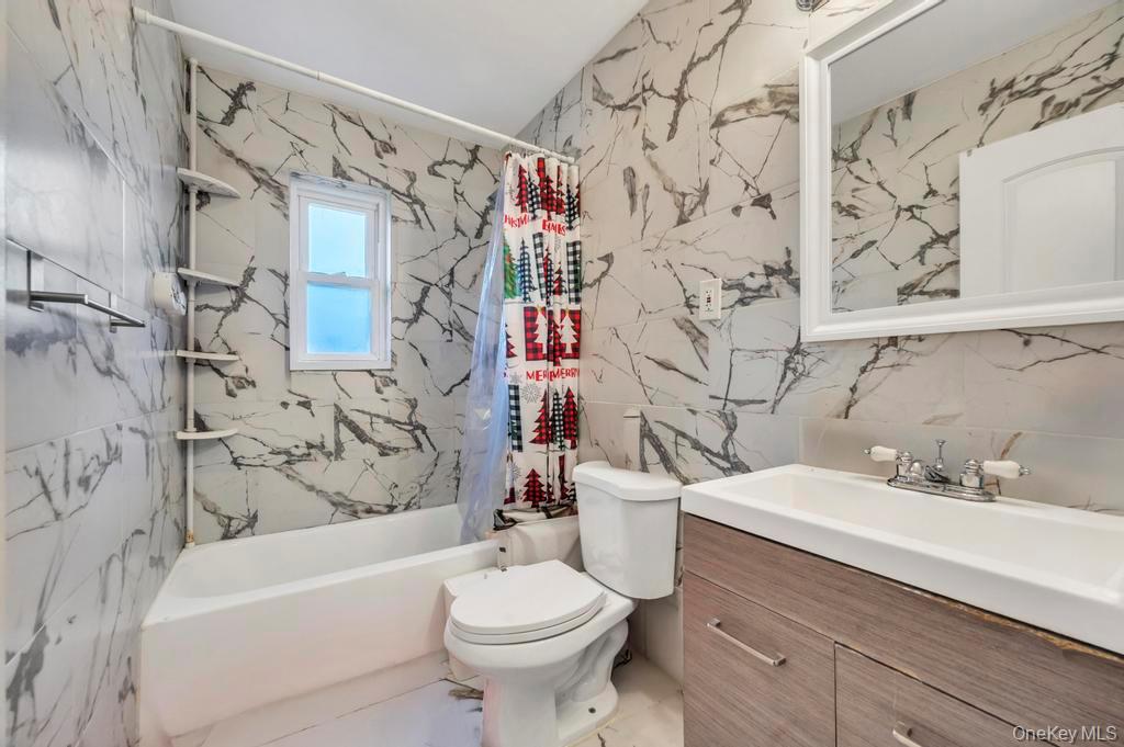 178-26 Zoller Road Queens, NY 11434 - Photo 19 of 26 a bathroom with a sink toilet and shower