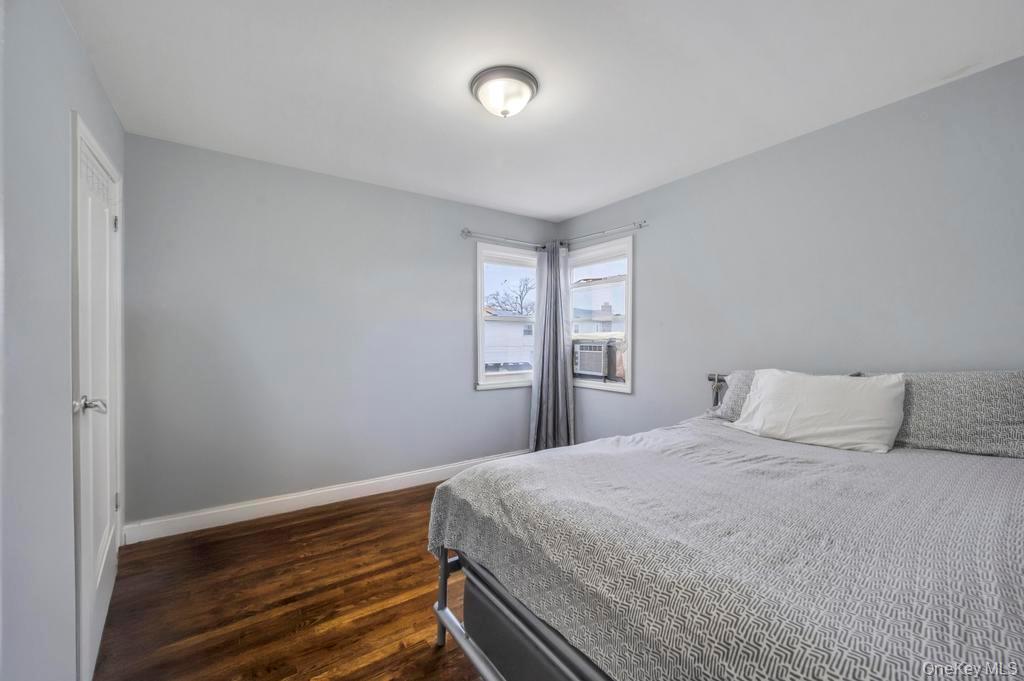 178-26 Zoller Road Queens, NY 11434 - Photo 20 of 26 a bedroom with a bed and a window