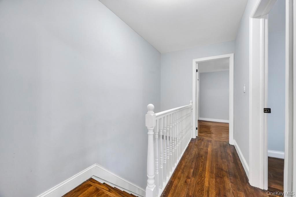178-26 Zoller Road Queens, NY 11434 - Photo 21 of 26 a view of a hallway with wooden floor