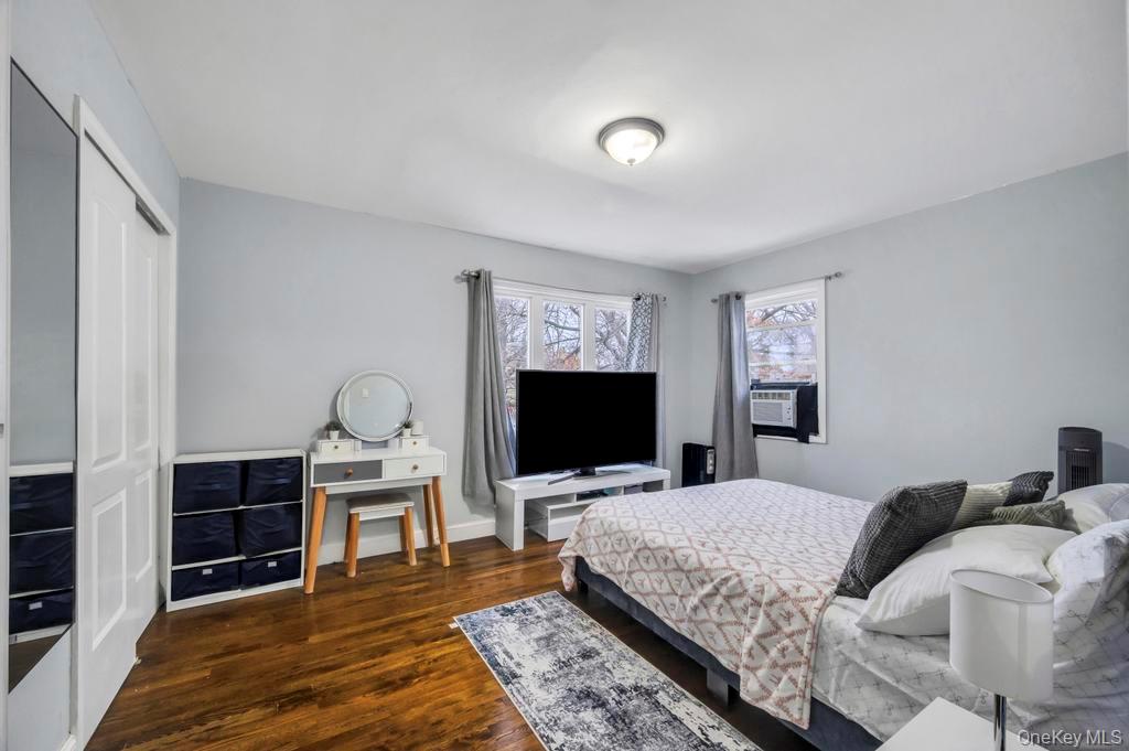 178-26 Zoller Road Queens, NY 11434 - Photo 23 of 26 a living room with furniture a flat screen tv and a fireplace