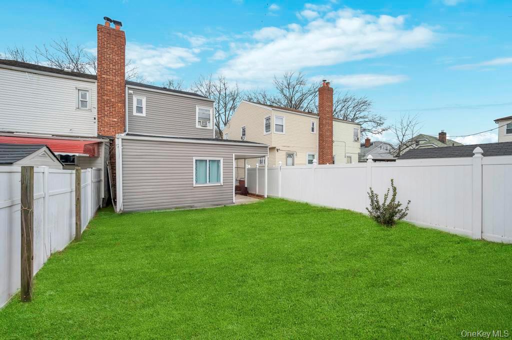 178-26 Zoller Road Queens, NY 11434 - Photo 25 of 26 a view of backyard with barbeque grill and plants