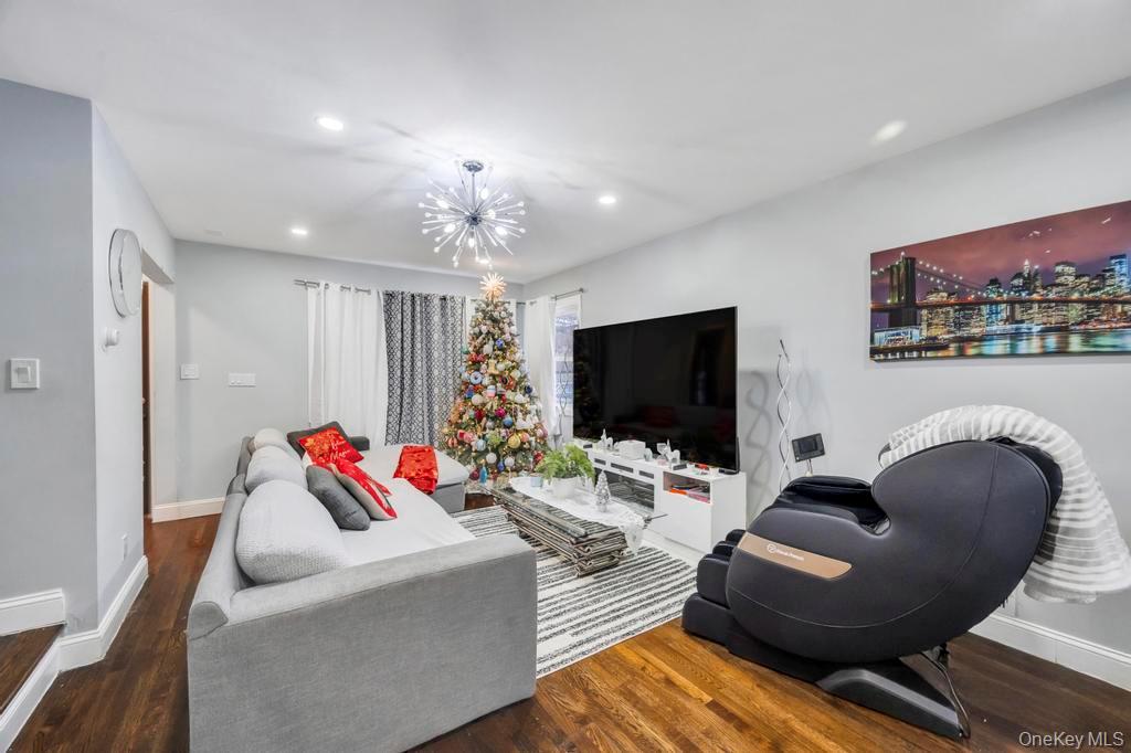 178-26 Zoller Road Queens, NY 11434 - Photo 7 of 26 a living room with furniture and a flat screen tv