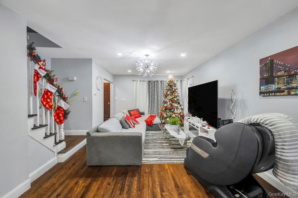 178-26 Zoller Road Queens, NY 11434 - Photo 8 of 26 a living room with furniture and a flat screen tv
