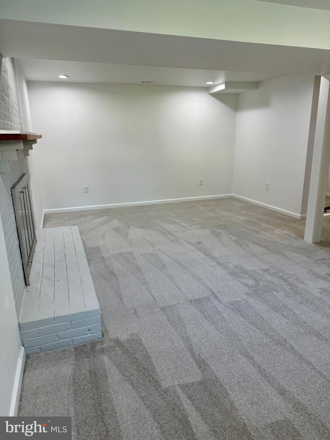 3600 4th Street North Beach, MD 20714 - Photo 14 of 32 an empty room with wooden floor and windows