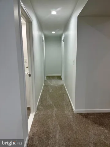 a view of hallway with closet