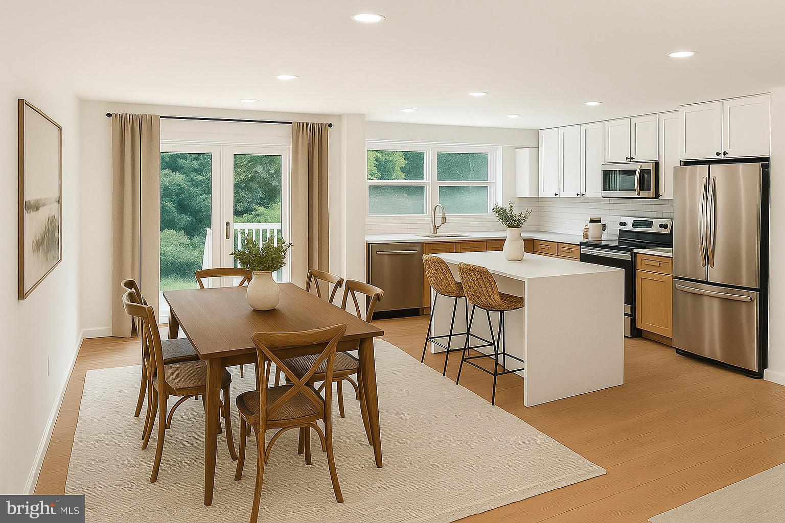 3600 4th Street North Beach, MD 20714 - Photo 22 of 32 a view of a dining room with furniture a kitchen and chandelier
