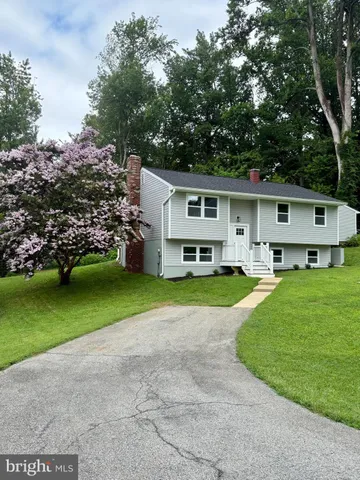 a view of kitchen with a sink and a large window