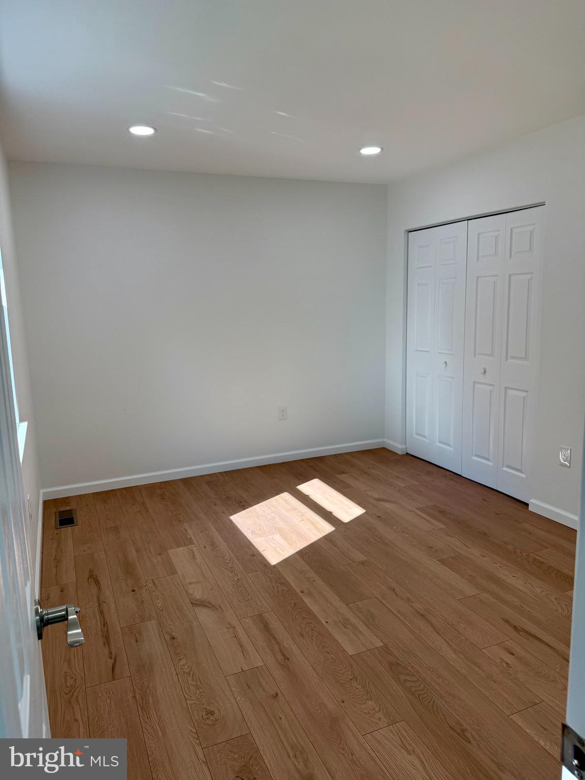 3600 4th Street North Beach, MD 20714 - Photo 6 of 32 a view of empty room with wooden floor