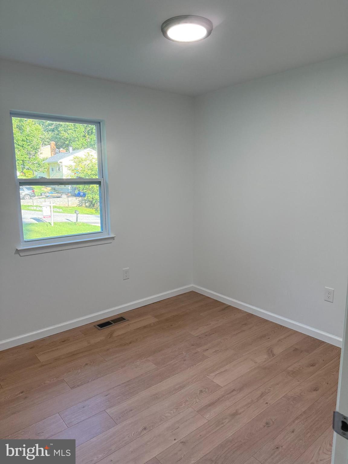 3600 4th Street North Beach, MD 20714 - Photo 9 of 32 an empty room with a window