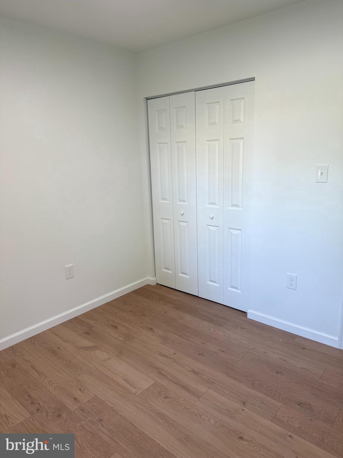 3600 4th Street North Beach, MD 20714 - Photo 10 of 32 a view of an empty room with wooden floor