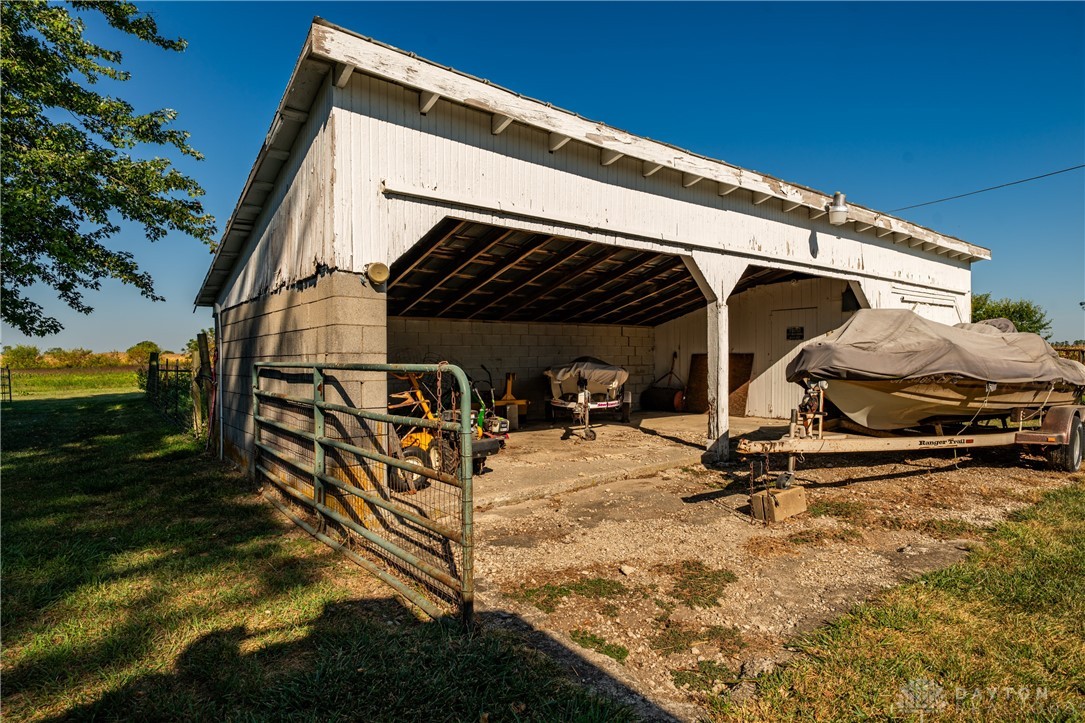1599 Garringer Road Jamestown, OH 45335 - Photo 53 of 73 This structure provides versatile storage for vehicles and equipment.
