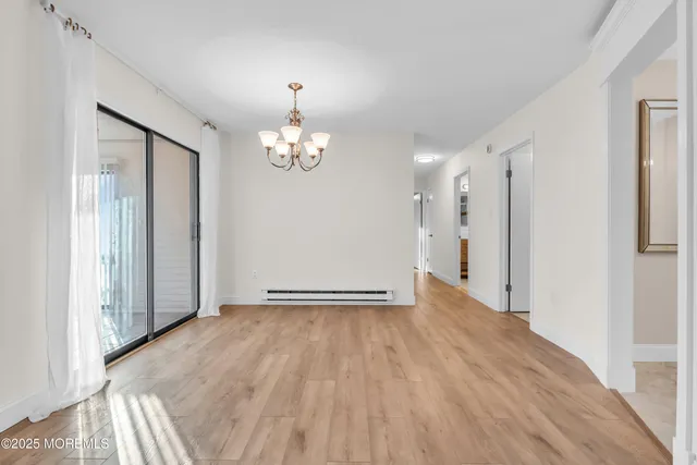 a view of livingroom with hardwood floor and hallway