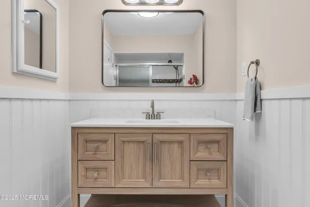 a bathroom with a sink and a mirror