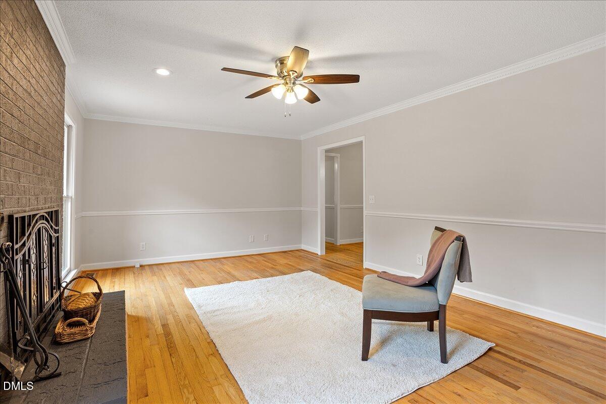 805 Rand Road Garner, NC 27529 - Photo 19 of 38 a view of a room with wooden floor fan and windows