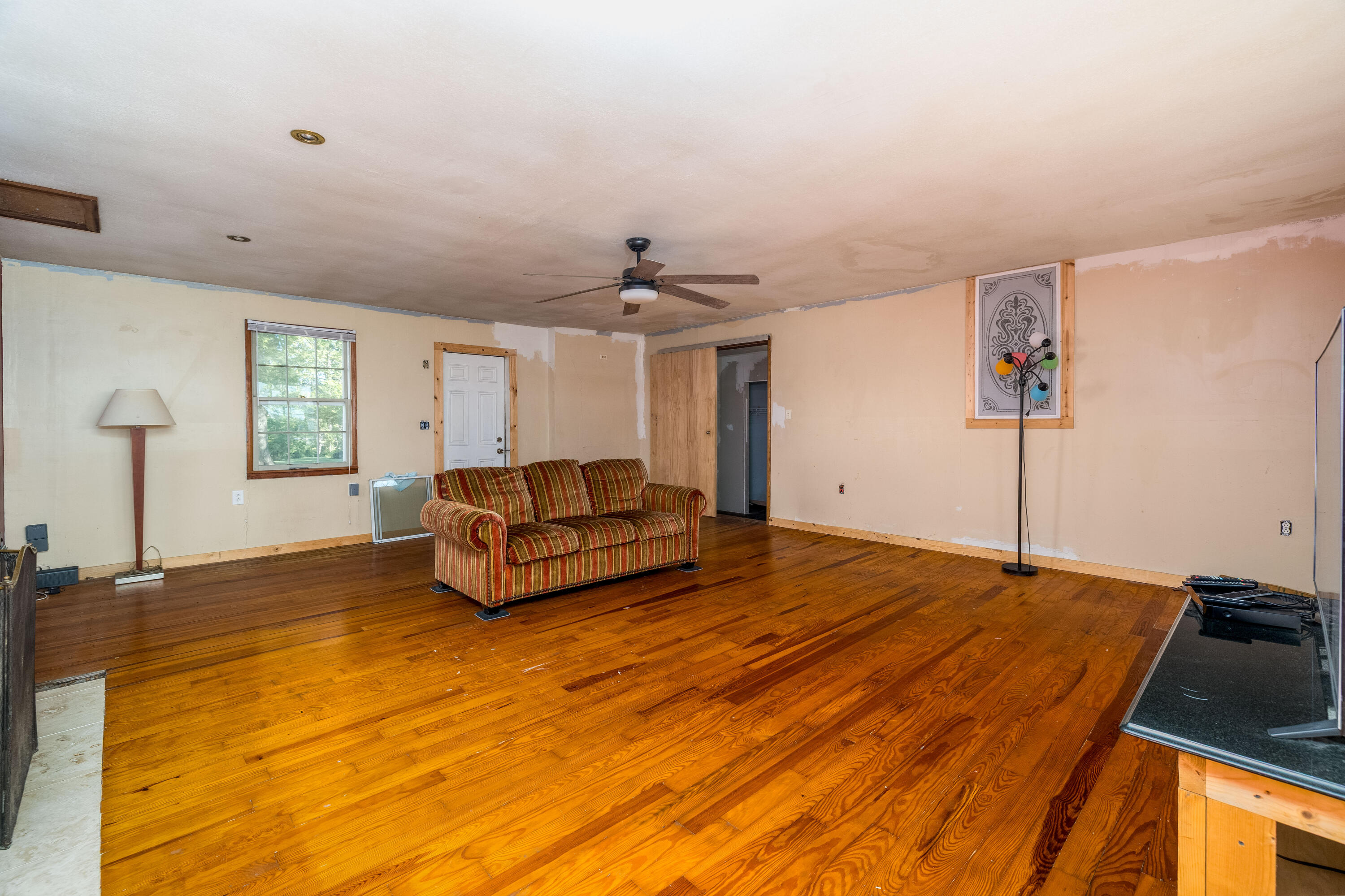 408 East Graham Street Kentland, IN 47951 - Photo 12 of 30 a spacious bedroom with a bed and window