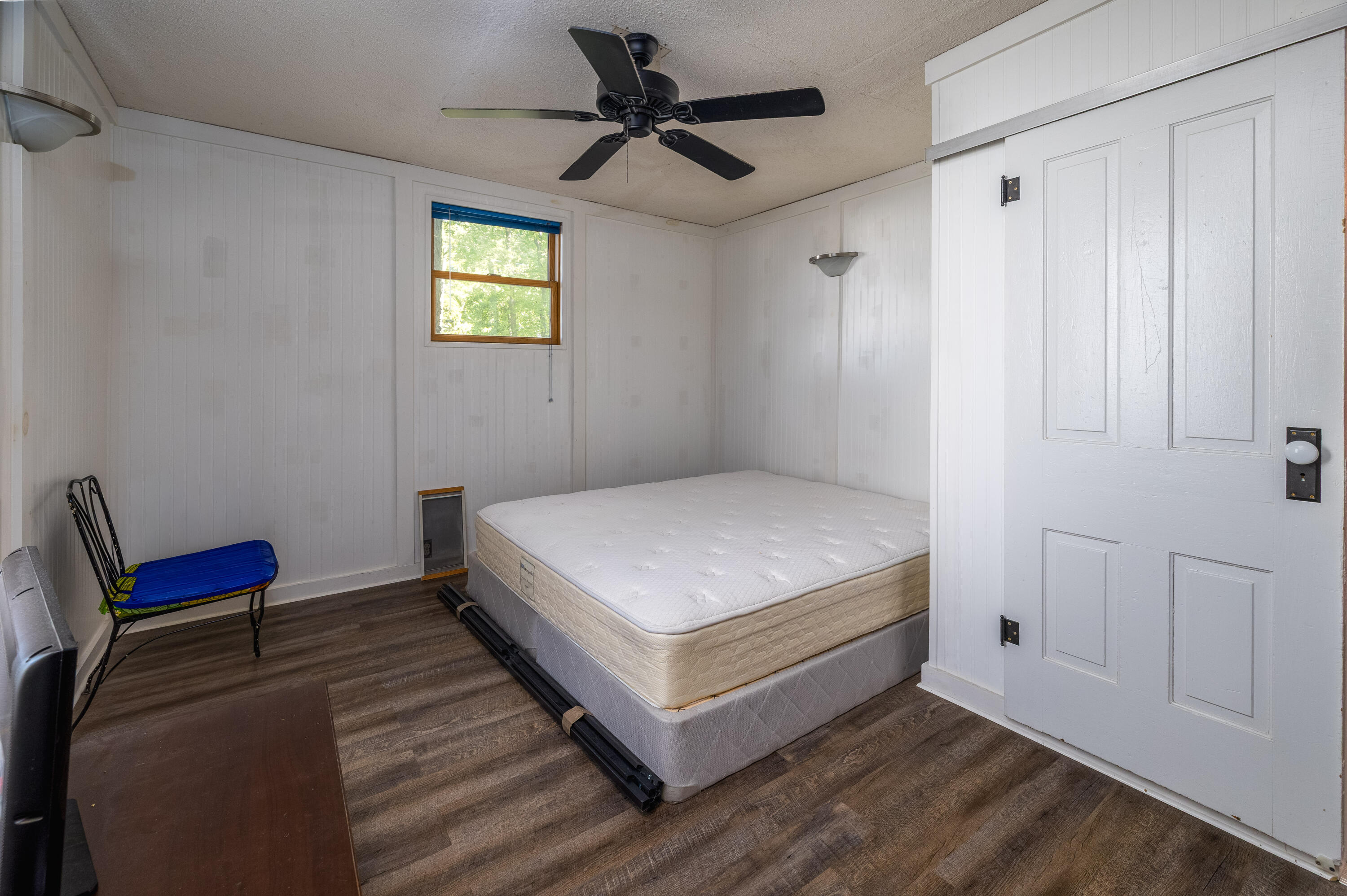 408 East Graham Street Kentland, IN 47951 - Photo 21 of 30 a bedroom with a bed and a chandelier