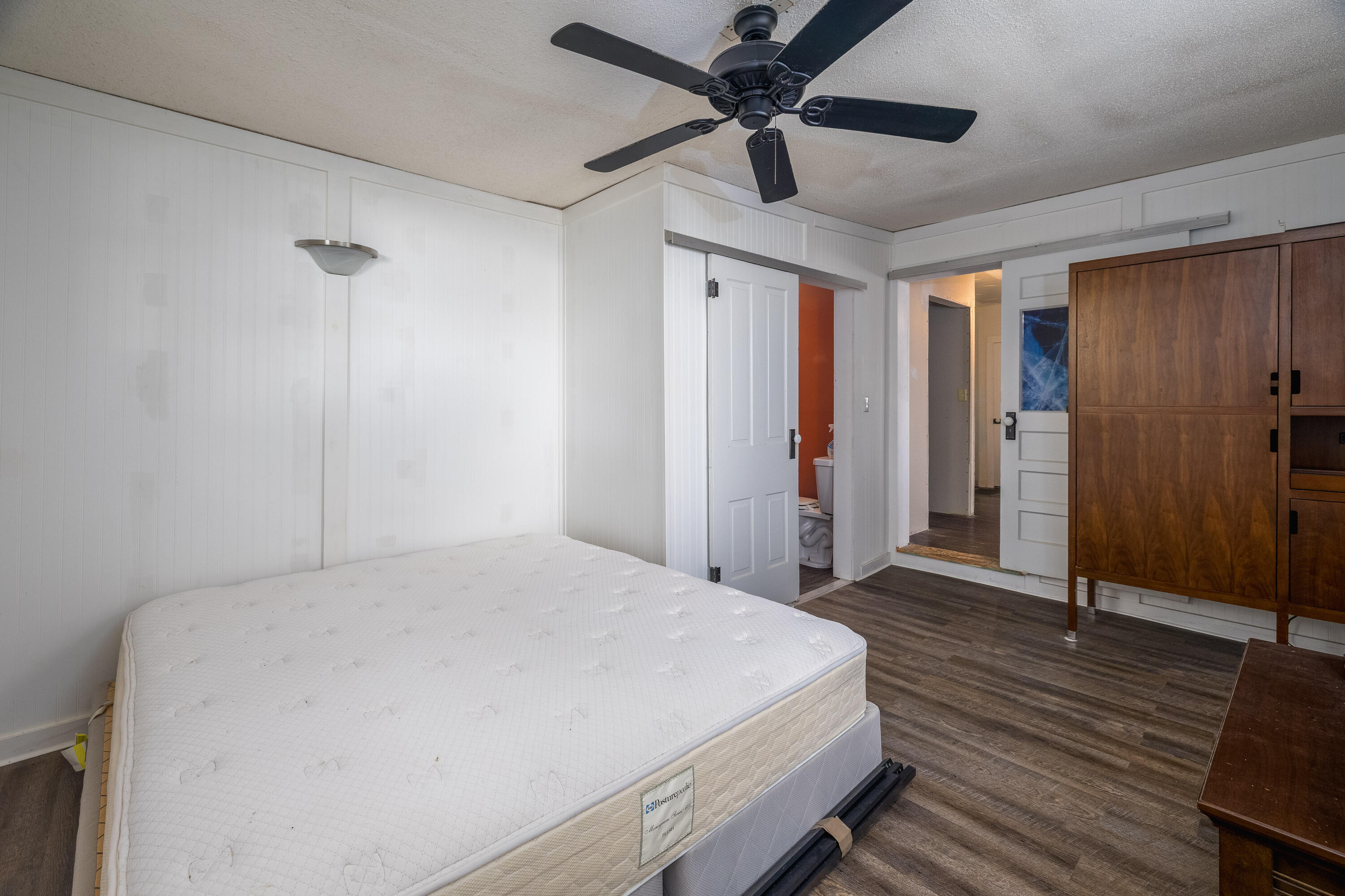 408 East Graham Street Kentland, IN 47951 - Photo 22 of 30 a bedroom with a bed and a chandelier