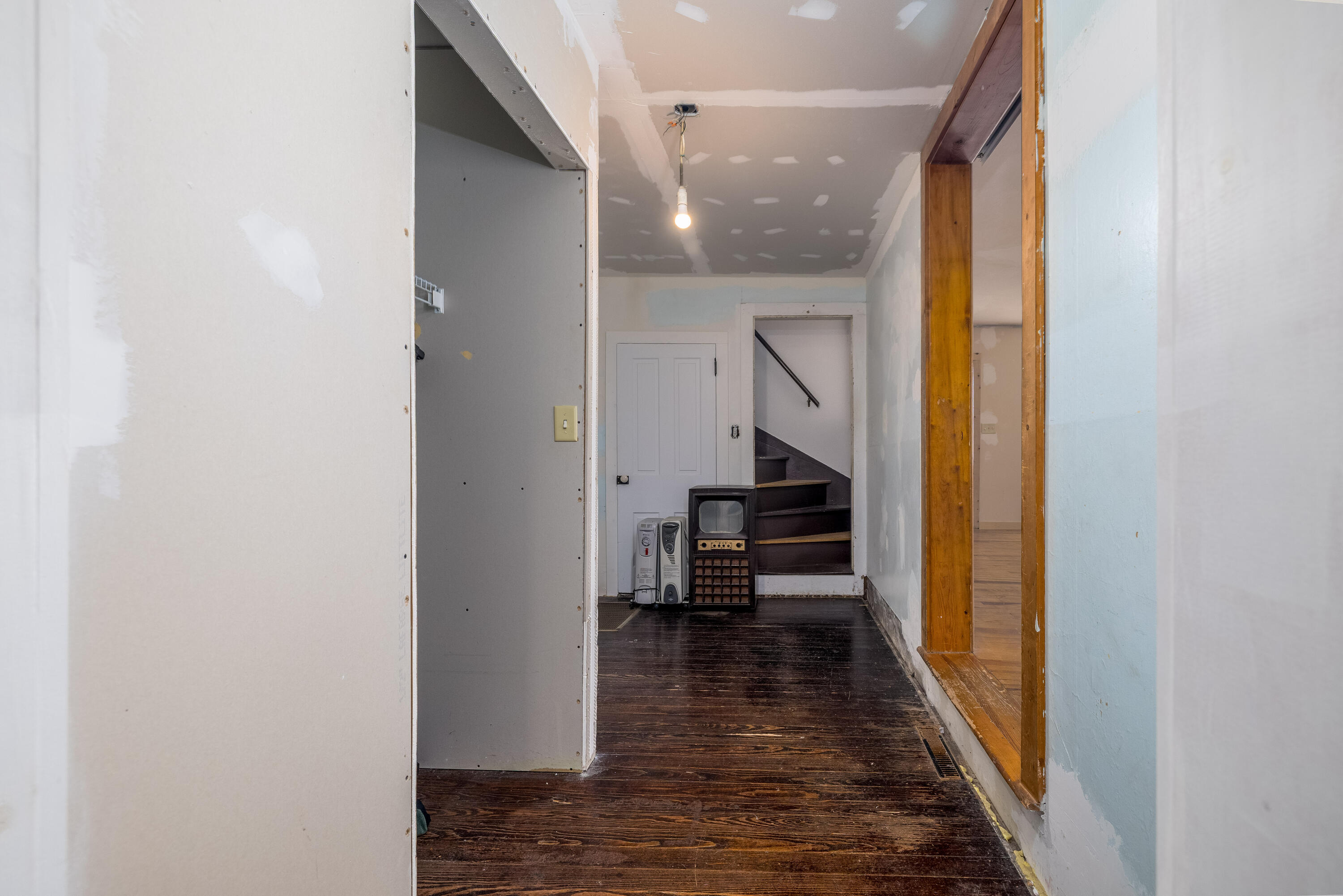 408 East Graham Street Kentland, IN 47951 - Photo 23 of 30 a view of a hallway with wooden floor and furniture