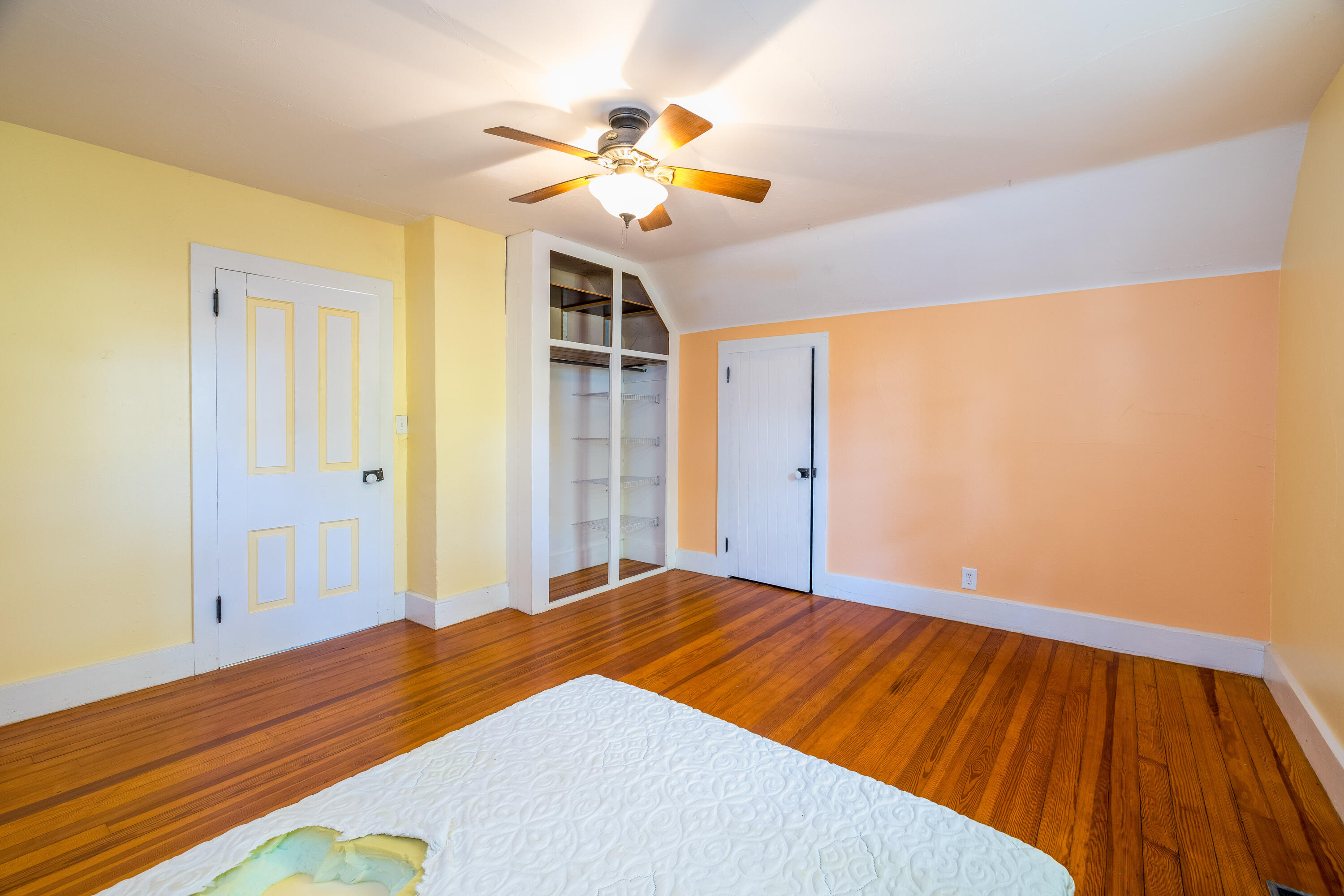 408 East Graham Street Kentland, IN 47951 - Photo 27 of 30 a bedroom with a bed and a chandelier