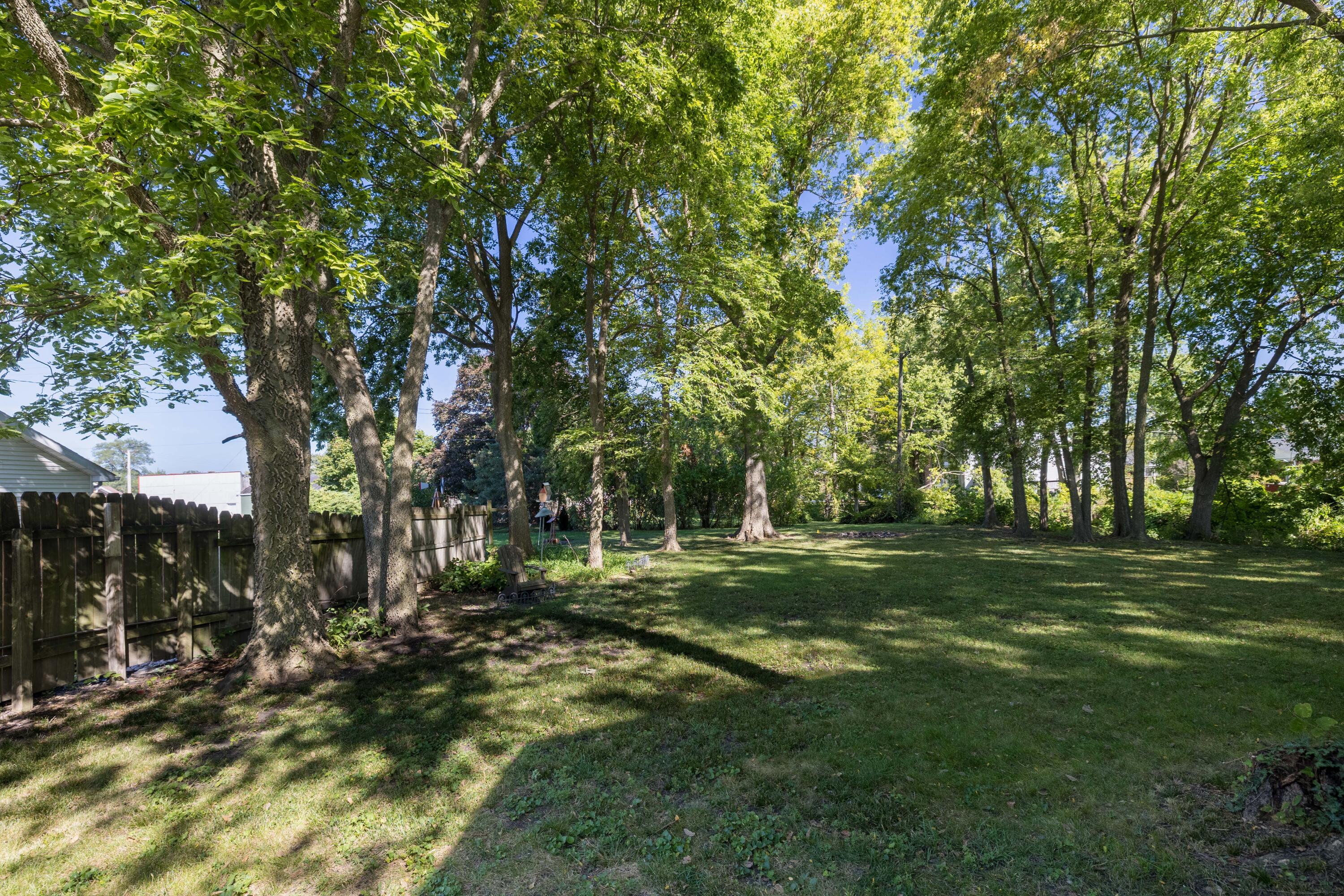 408 East Graham Street Kentland, IN 47951 - Photo 8 of 30 a big yard with lots of green space and trees