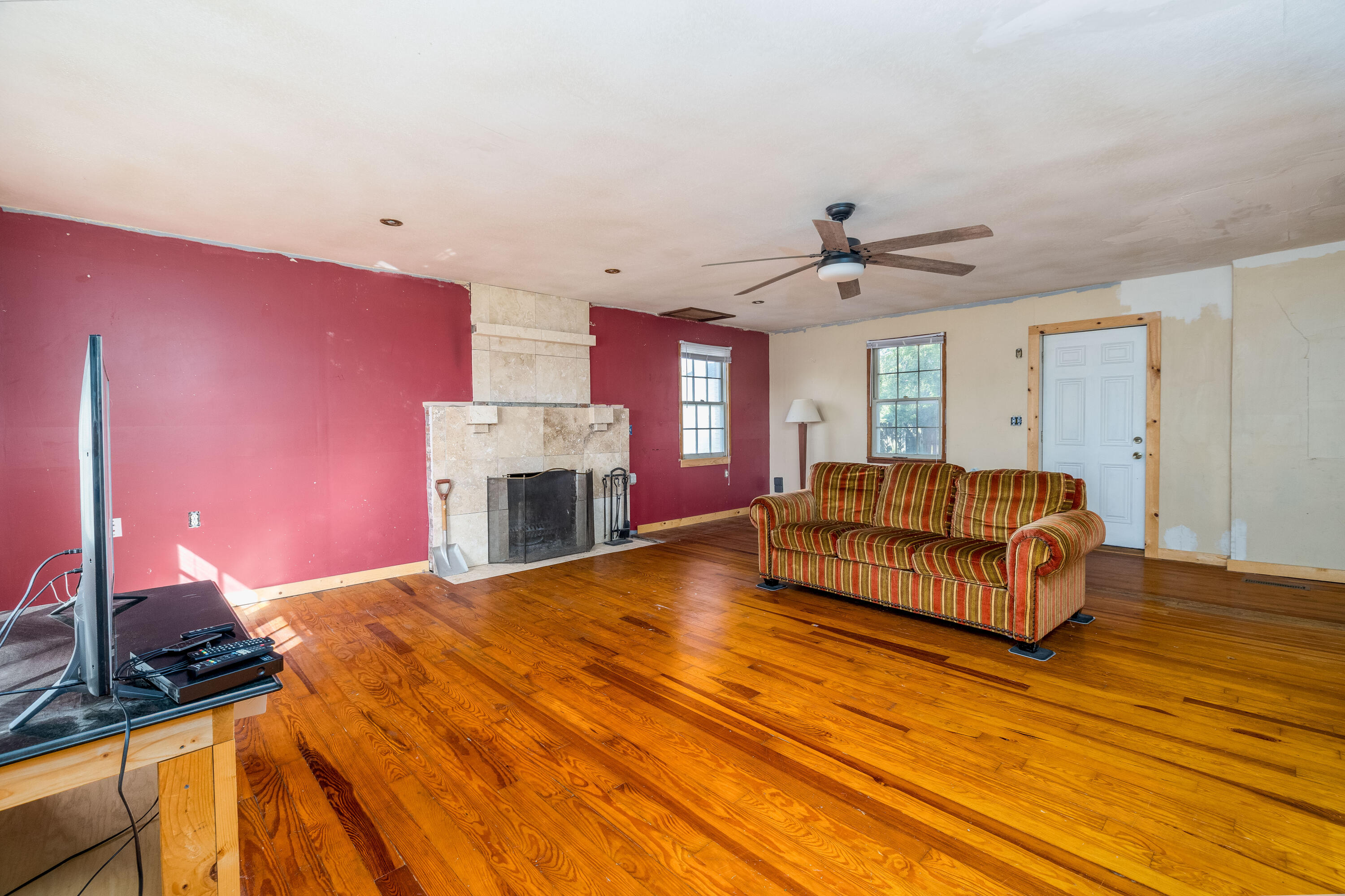 408 East Graham Street Kentland, IN 47951 - Photo 9 of 30 a spacious bedroom with a bed and a fireplace