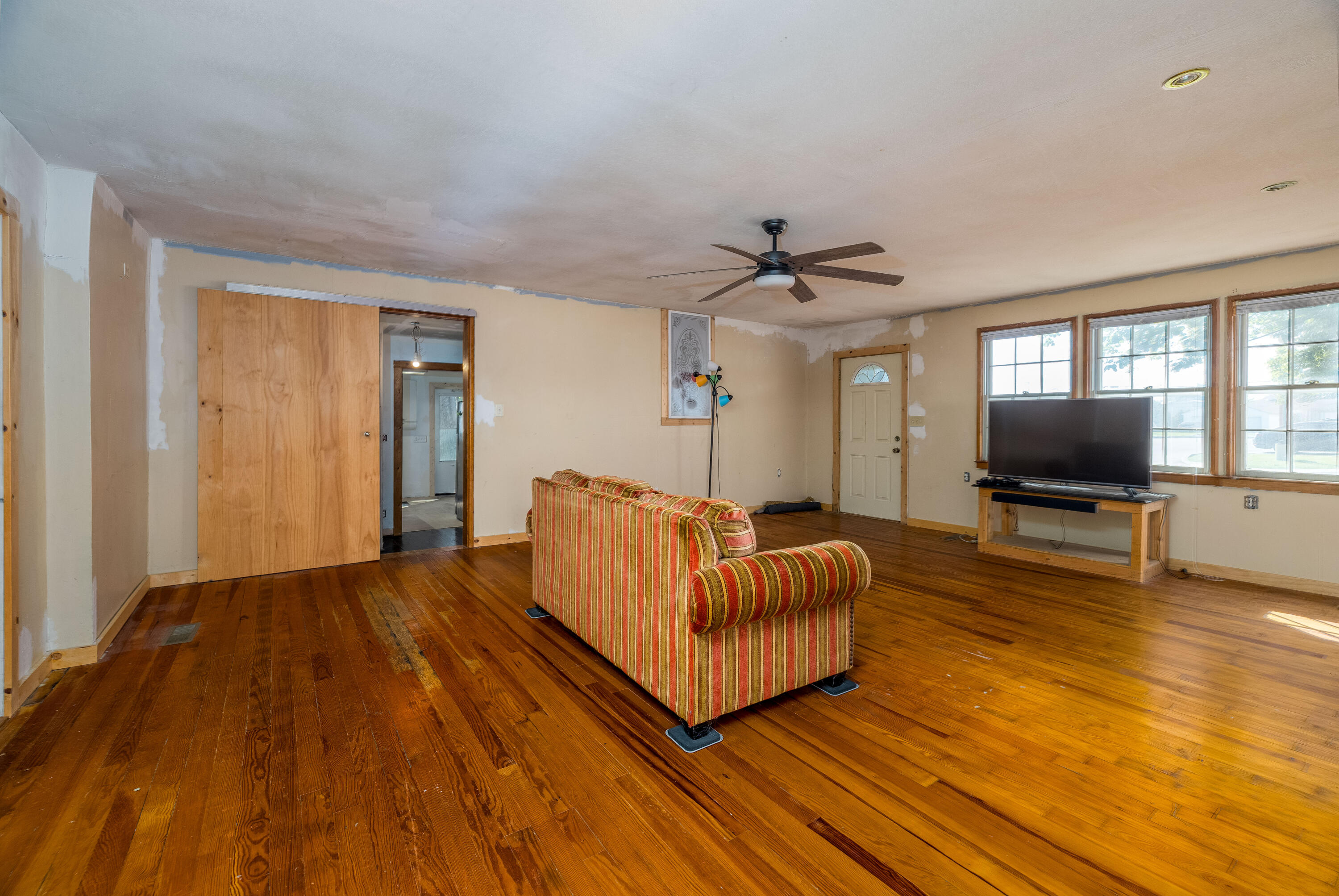 408 East Graham Street Kentland, IN 47951 - Photo 10 of 30 a living room with furniture and a flat screen tv