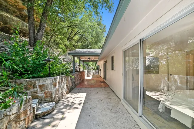 a view of a porch with wooden floor