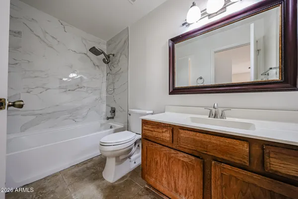 a bathroom with a bathtub and a toilet