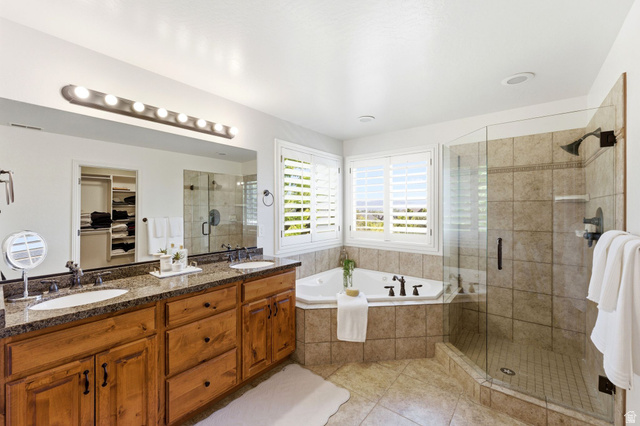 1712 Somerset Ridge Drive Draper, UT 84020 - Photo 36 of 76 Bathroom featuring a dual vanity with wood cabinetry and a stone countertop