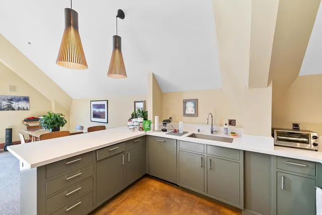 a kitchen with a sink and cabinets