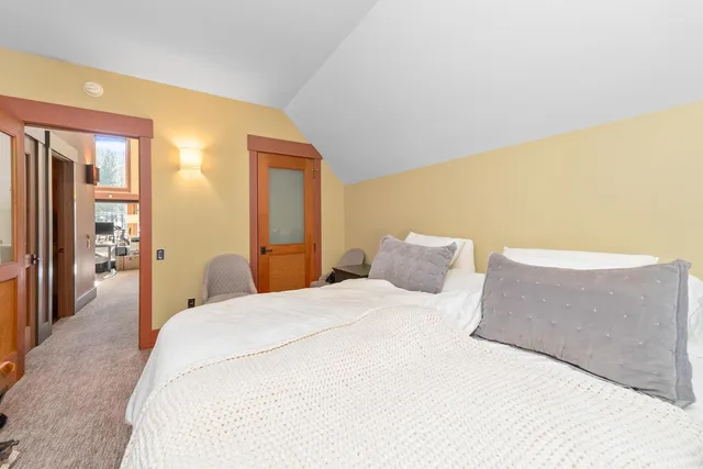 a view of a livingroom with workspace and a window