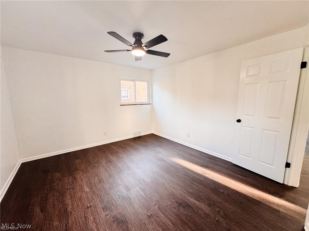 2907 Snow Road, Unit UP Cleveland, OH 44134 - Photo 10 of 19 Unfurnished room featuring dark wood-type flooring and ceiling fan