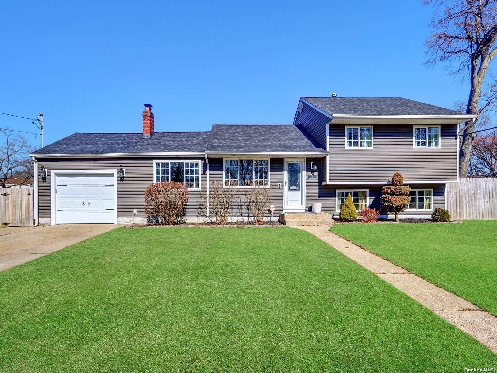 a front view of a house with a garden and porch