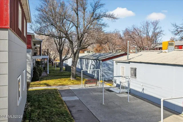 a front view of a house with basket ball court