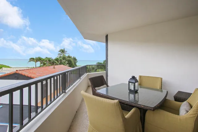 a view of balcony with furniture