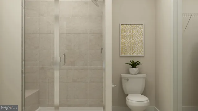 a white toilet sitting next to a bathroom sink