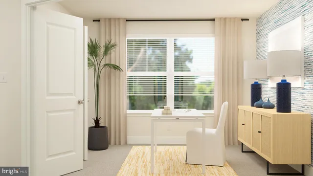 a living room with furniture and large windows