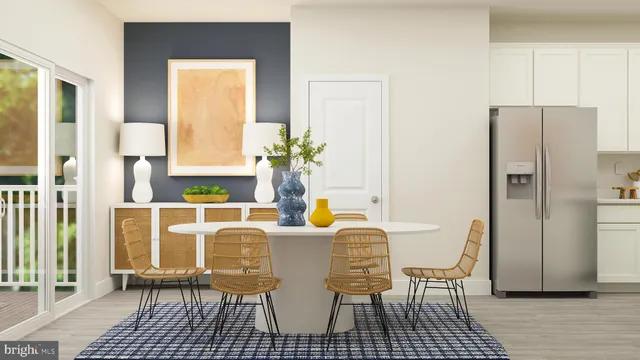 a dining room with furniture and a window