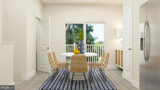 a dining room with furniture and wooden floor