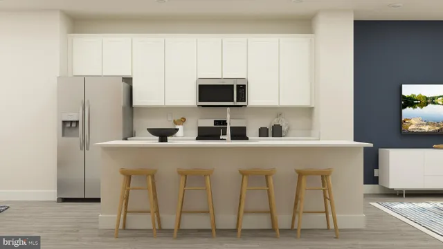 a close view of a kitchen with appliances and cabinets